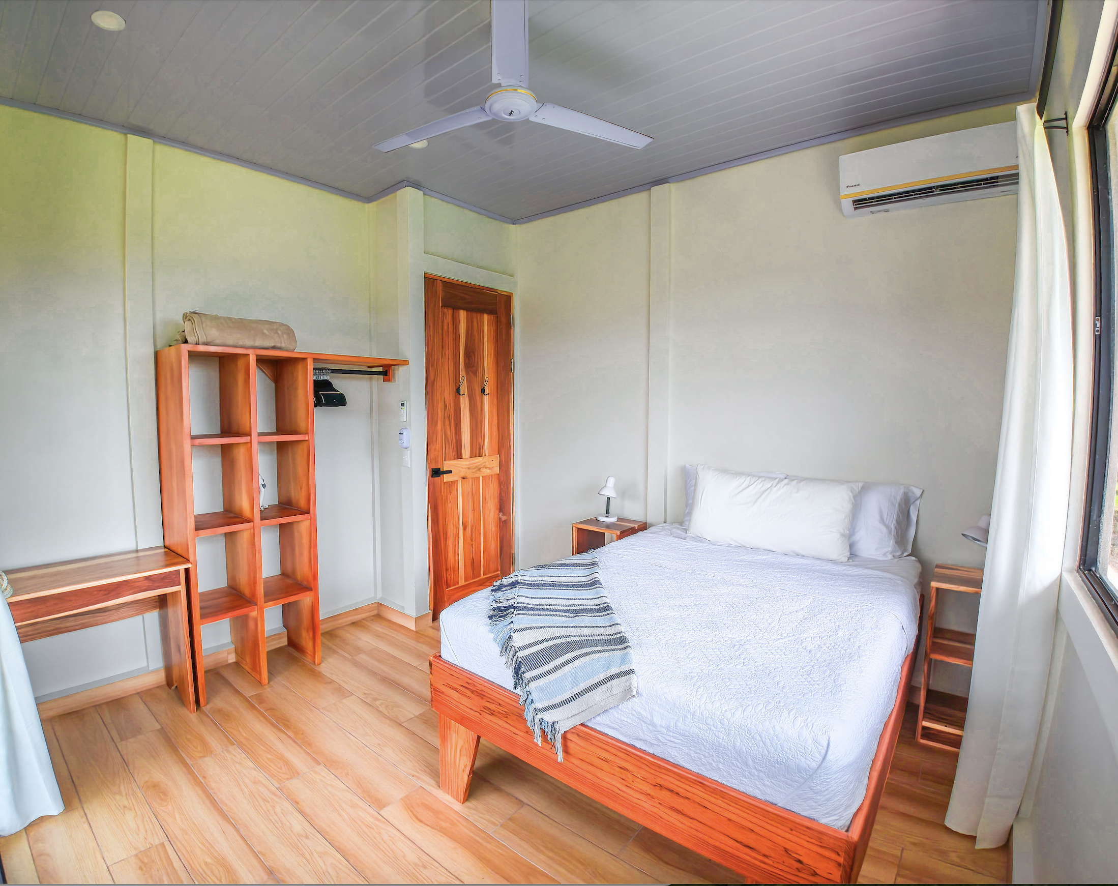 Double bedroom with teak furniture and valley views