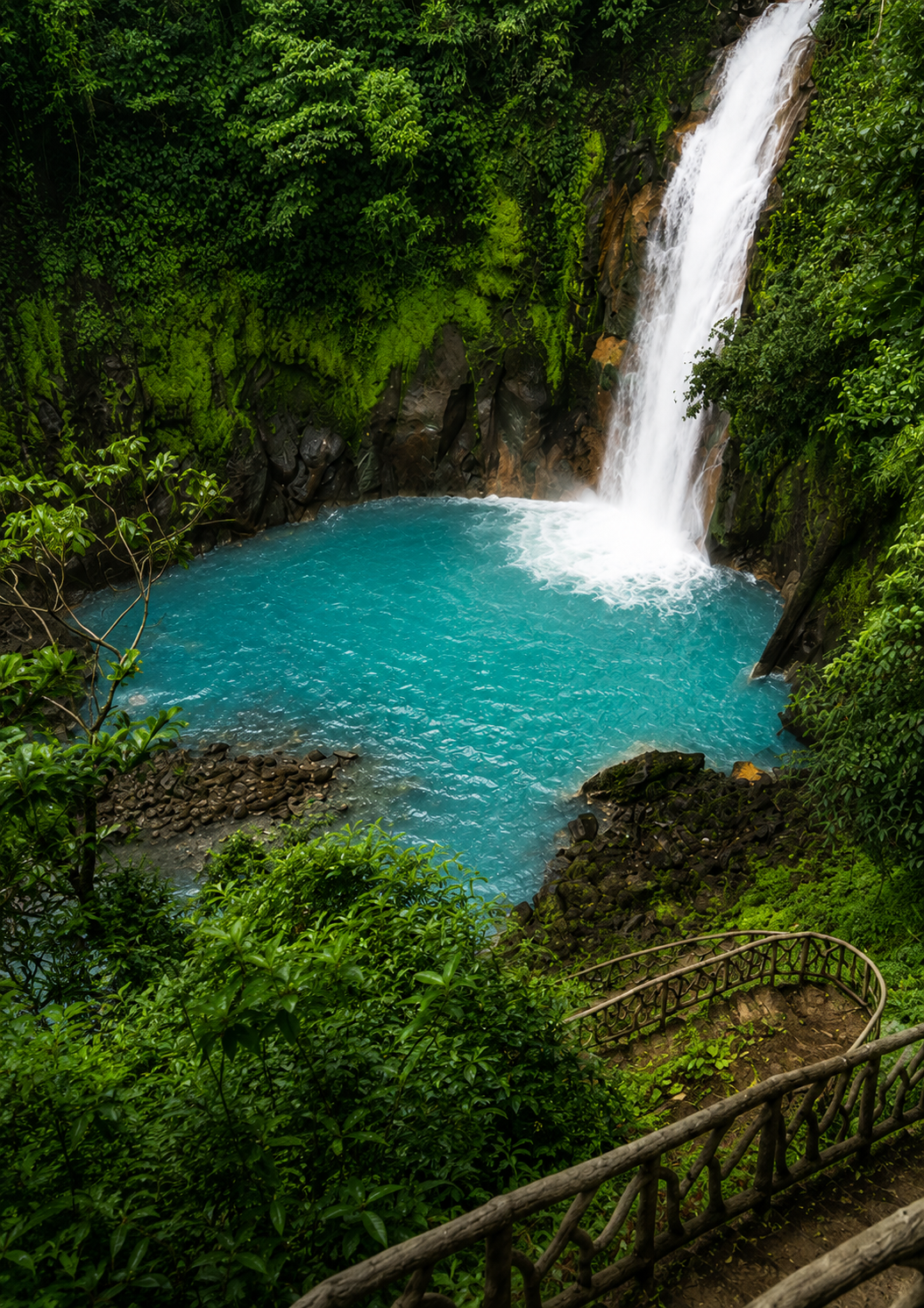 Hiking the stairs at Río Celeste in Tenorio National Park